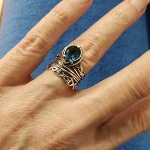 Pear shaped blue topaz band ring